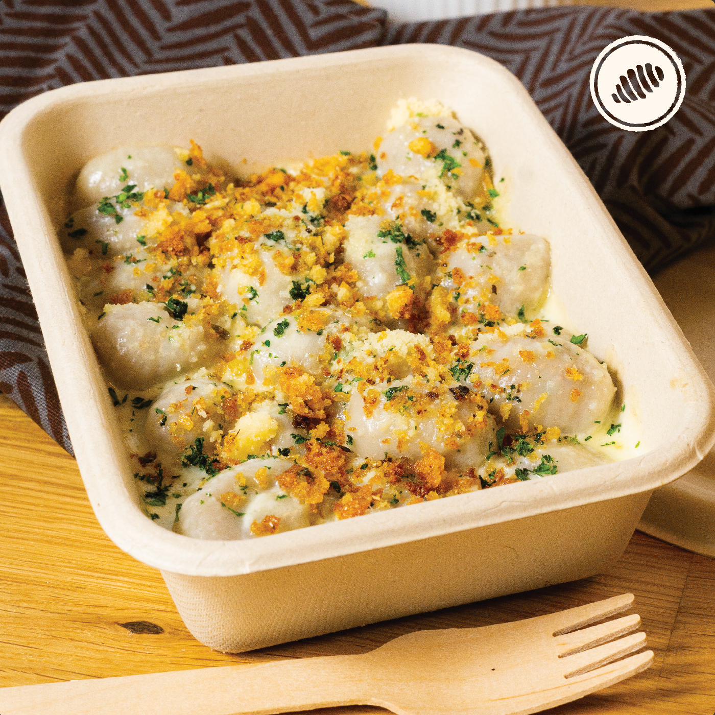 Ñoquis de malanga con salsa Alfredo cremosa.